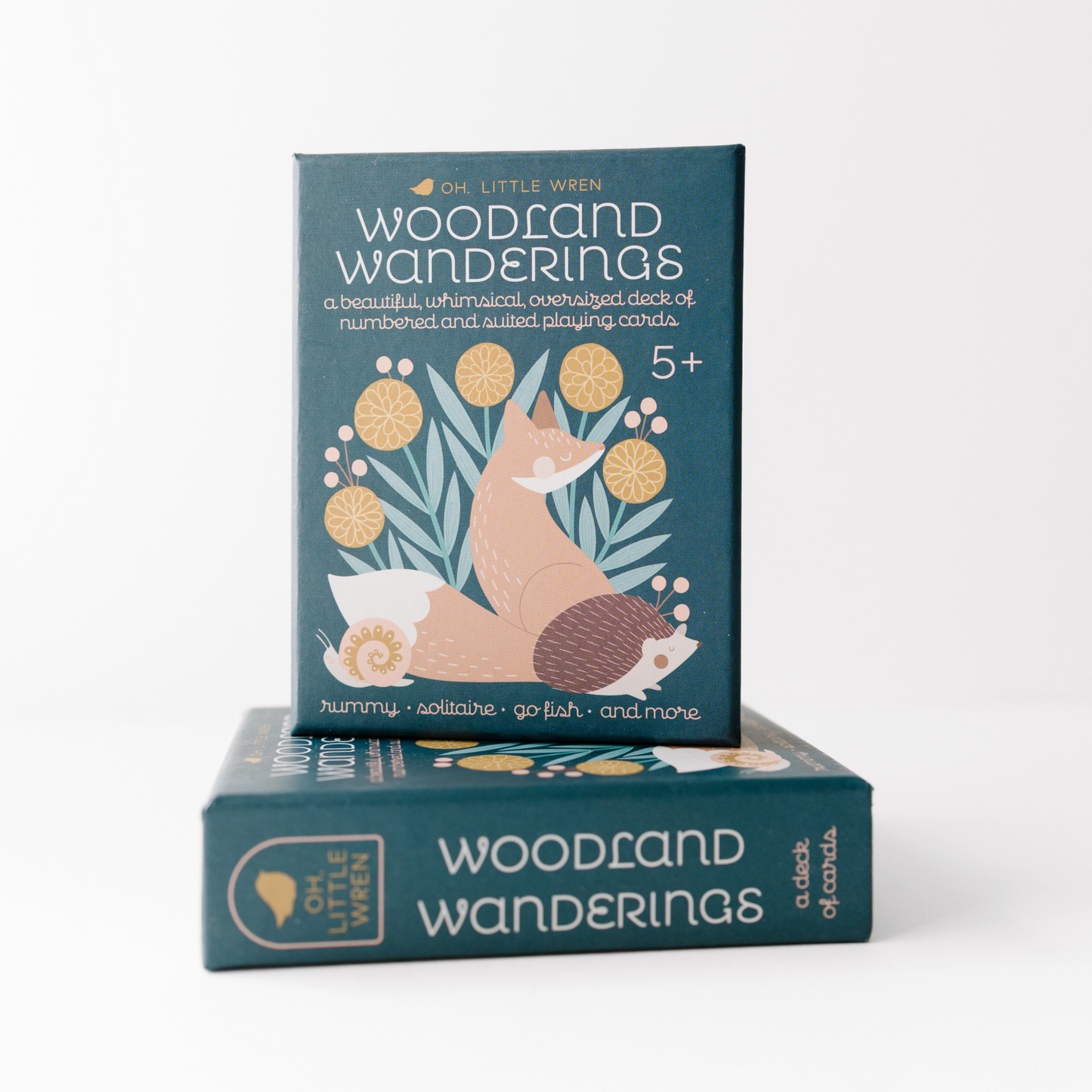 two boxes of woodland wandering cards are stacked--with the top box facing outward and the bottom box on it's side.